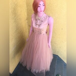 Beautiful dress for a special occasion. It was worn once. Dusty rose in color